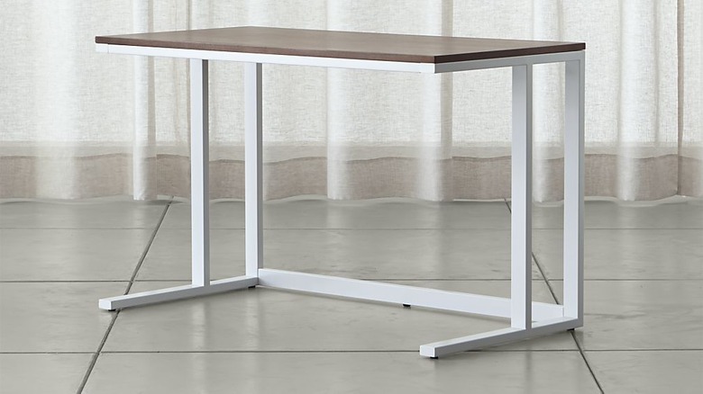 Minimal desk with white frame and walnut wood top