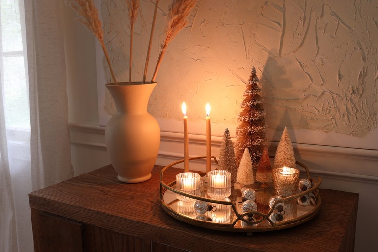 DIY mirrored tray holiday centerpiece with candles lit