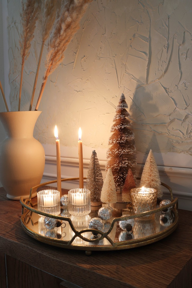 DIY mirrored tray holiday centerpiece with candles lit