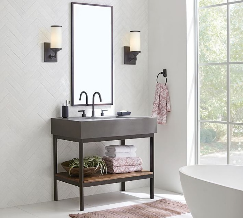 modern bathroom vanity with concrete top and open storage