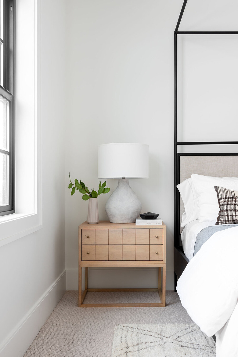 organic cement table lamp on wooden bedside table