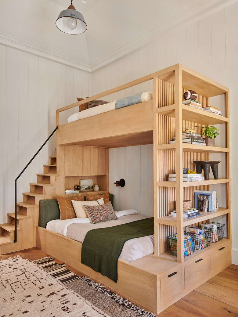 wooden bunk beds with small farmhouse light