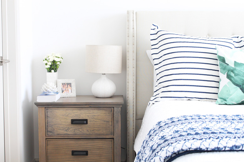 plain white table lamp on a nightstand