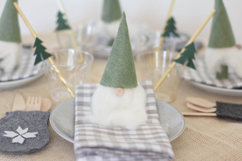 Scandinavian decorative gnomes on gray plaid napkins and gray plates