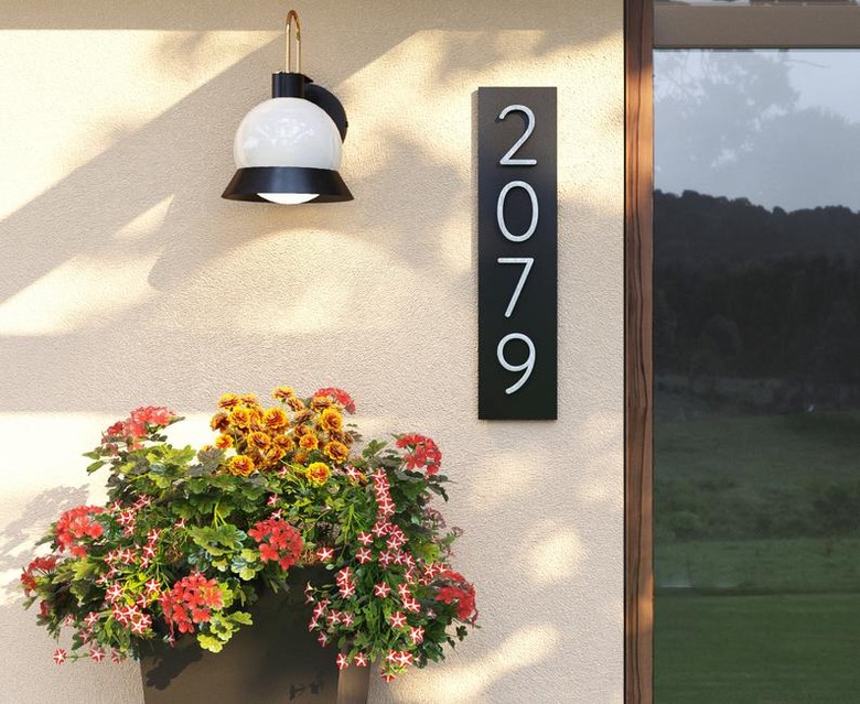 modern house numbers on metal plaque