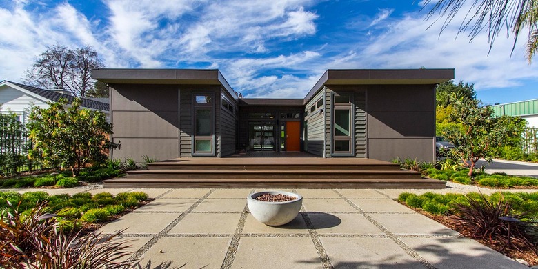 U-shaped modern prefab home with entryway courtyard