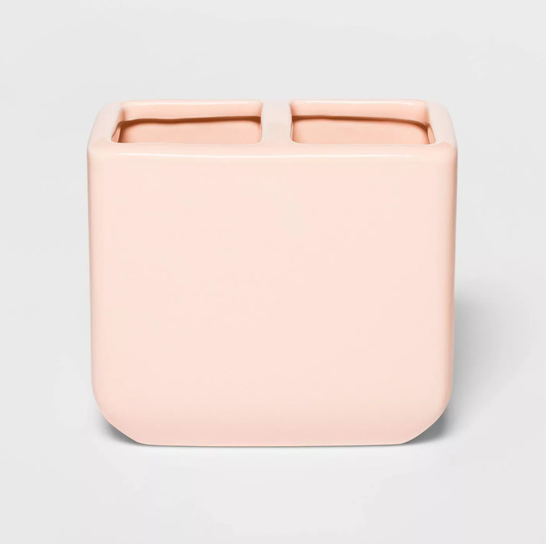 Pink toothbrush holder with two compartments