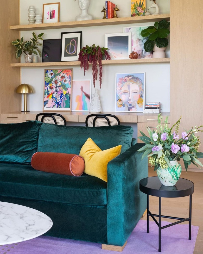 Living room with teal velvet sofa