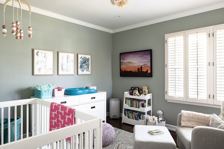 bright nursery with sage green walls