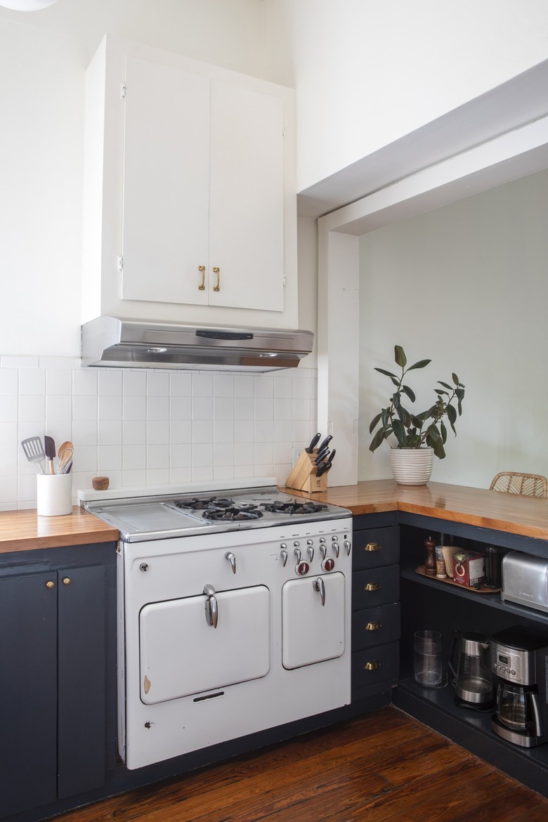 a kitchen with contemporary blue cabinets