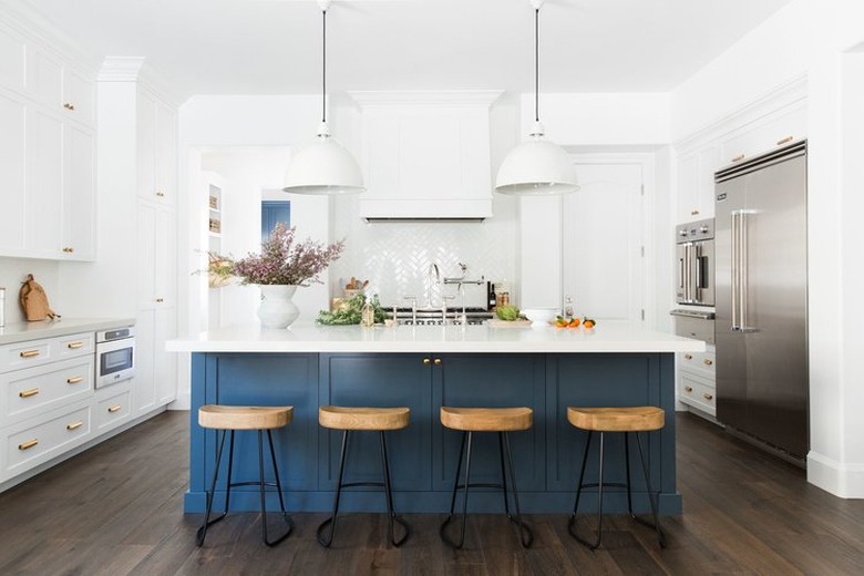 White and navy blue kitchen color idea with navy blue island and wood barstools