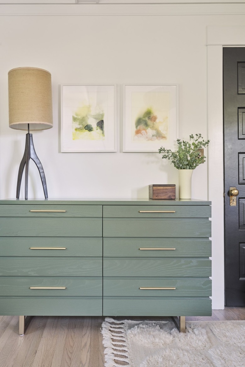 primary bedroom with green dresser