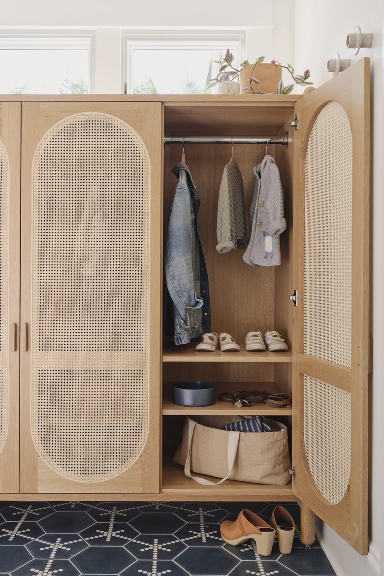 mudroom with storage cabinet for rain boots