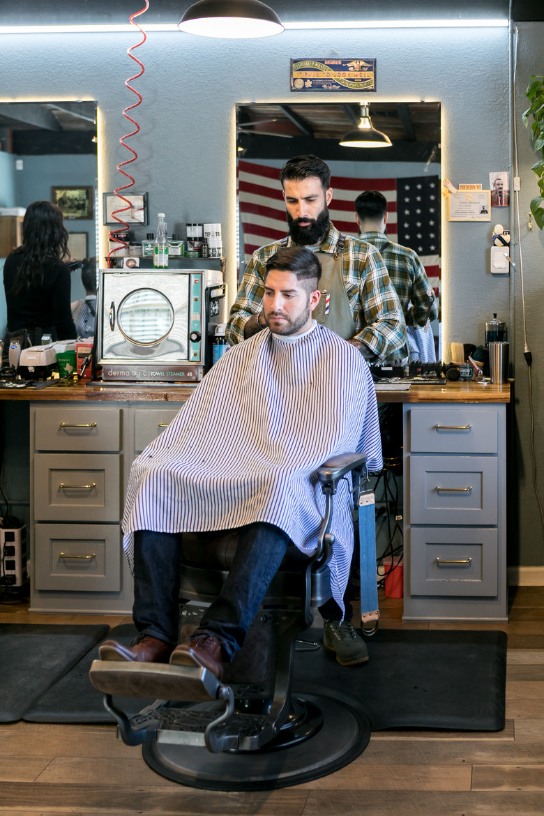 Tending to a client at the Rosewood Barbershop