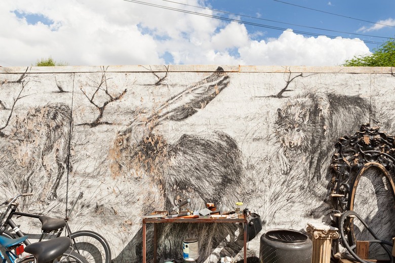 A mural of animals with a worktable