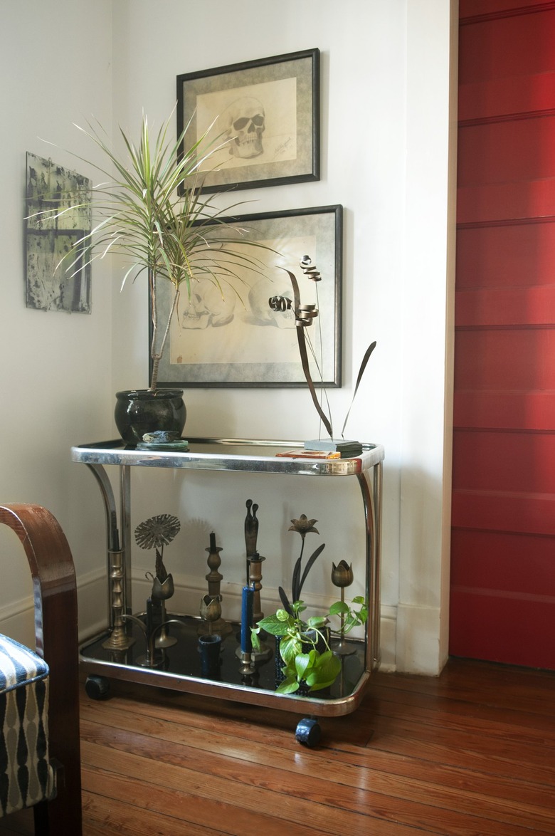 A 1970s bar cart sits on the corner of the Picasso Room