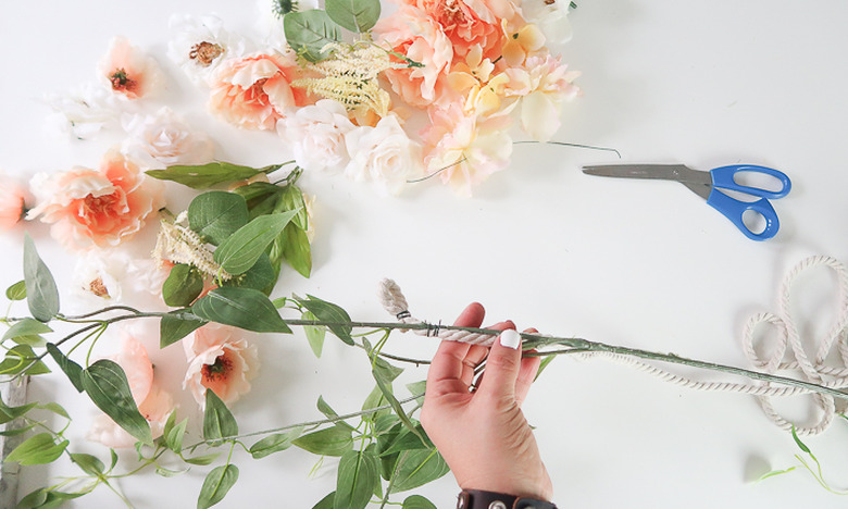 Secure greenery to rope.