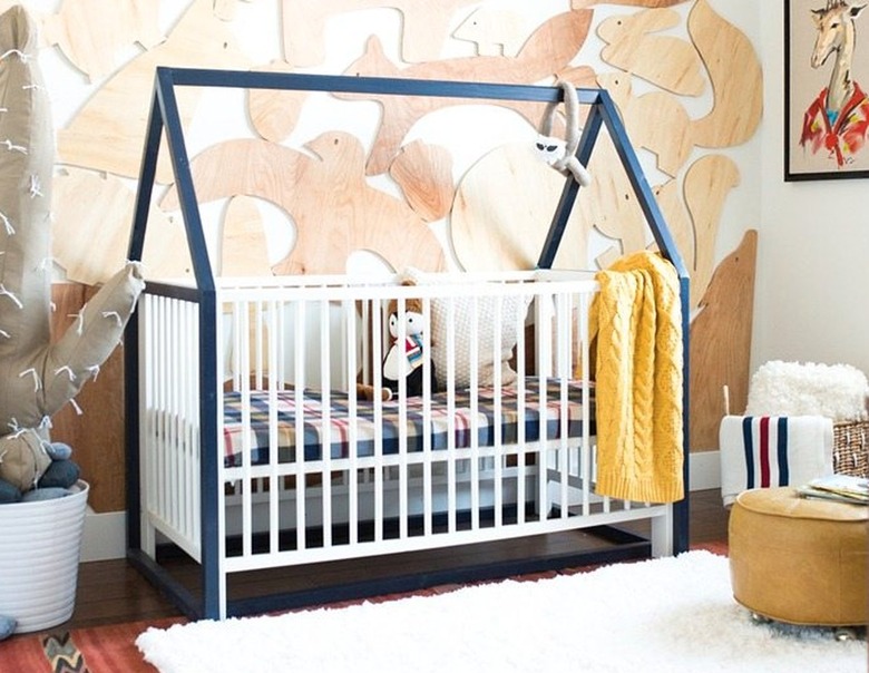 Crib with blue house frame