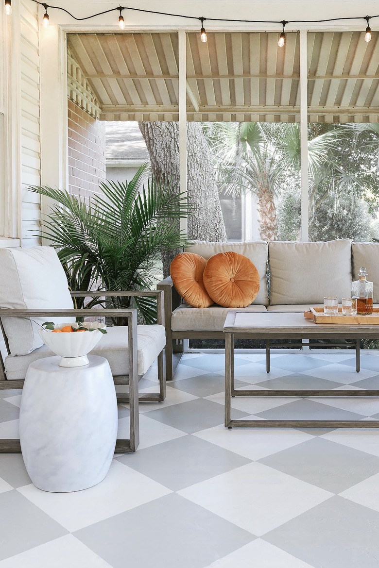 Painted checkerboard floor in sunroom