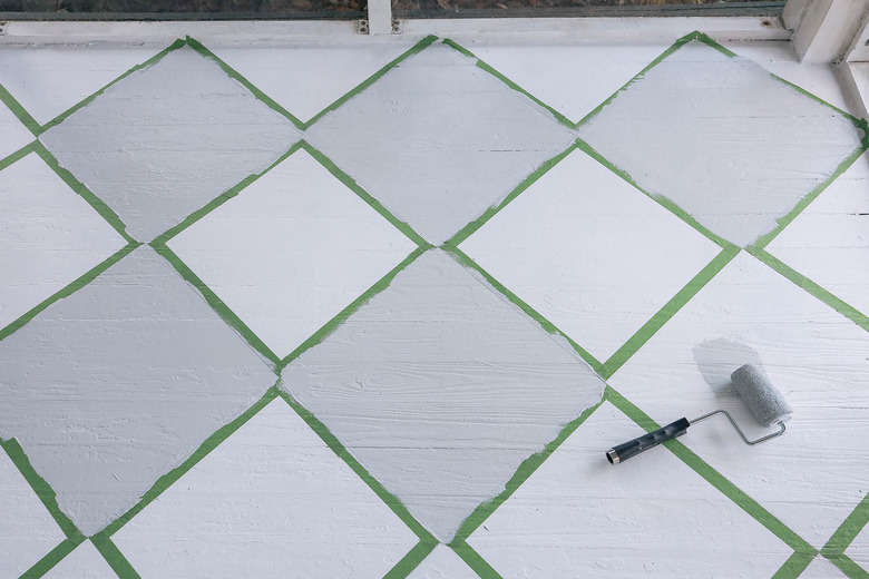 Painting diamonds on floor with small roller brush