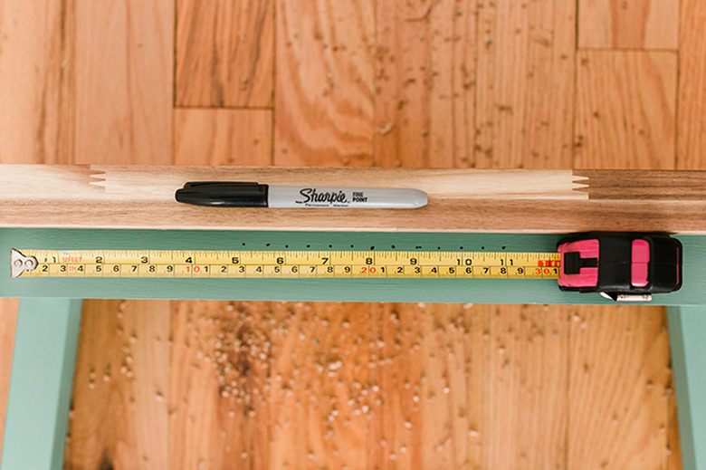 Mark holes for the rope to run through.