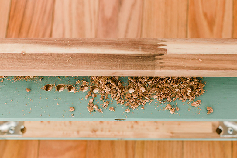 Drill through the marked holes.