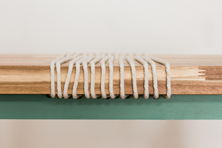 Run the rope around and through the bench seat to give it a cool linear focal point.