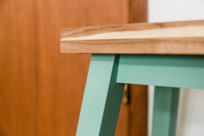 Brush a wax coating over the chalk decorative paint.