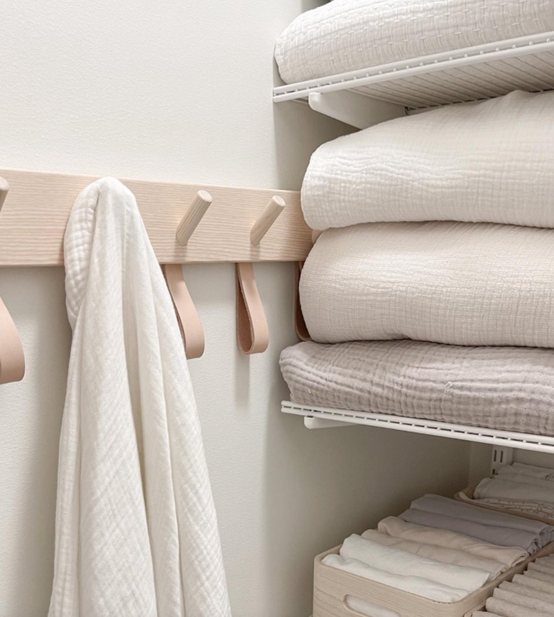 Close up on linen closet with blankets