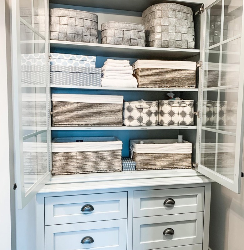 Linen armoire with baskets