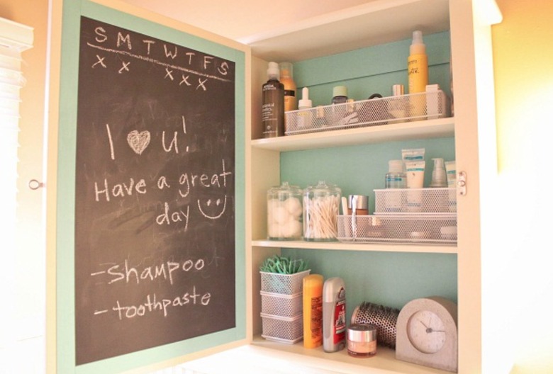 Medicine cabinet with chalkboard inside.