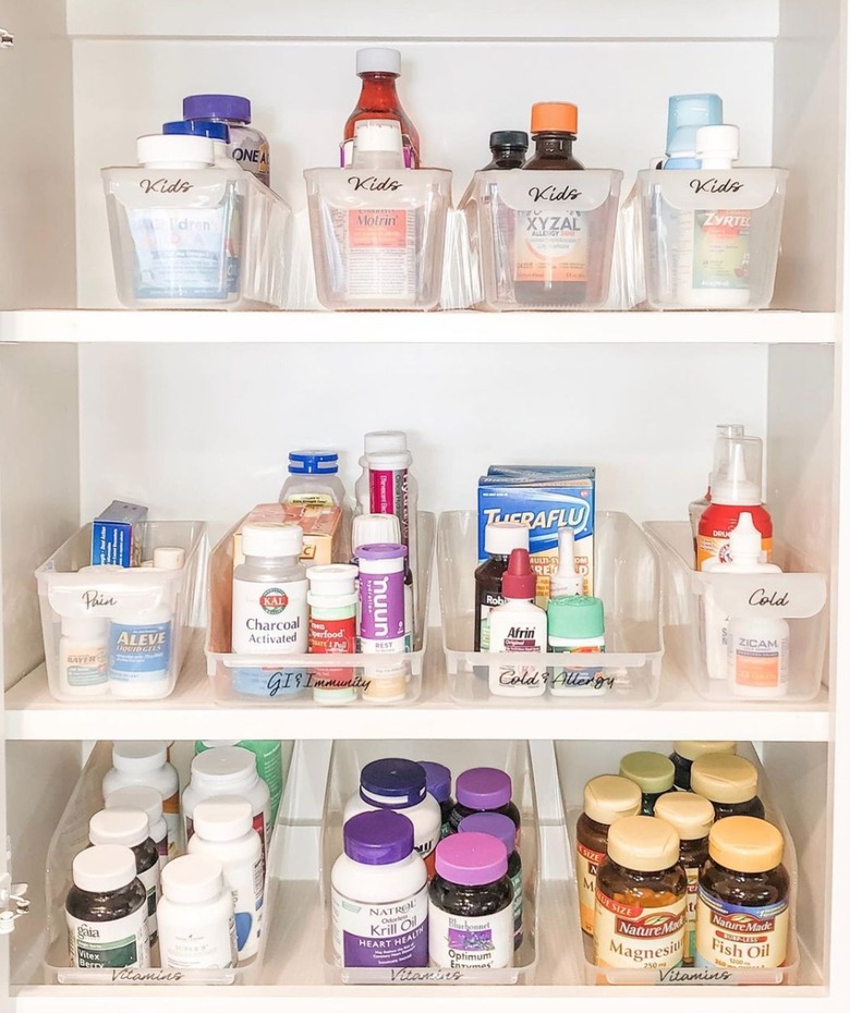 Medicine cabinet organized in bins.