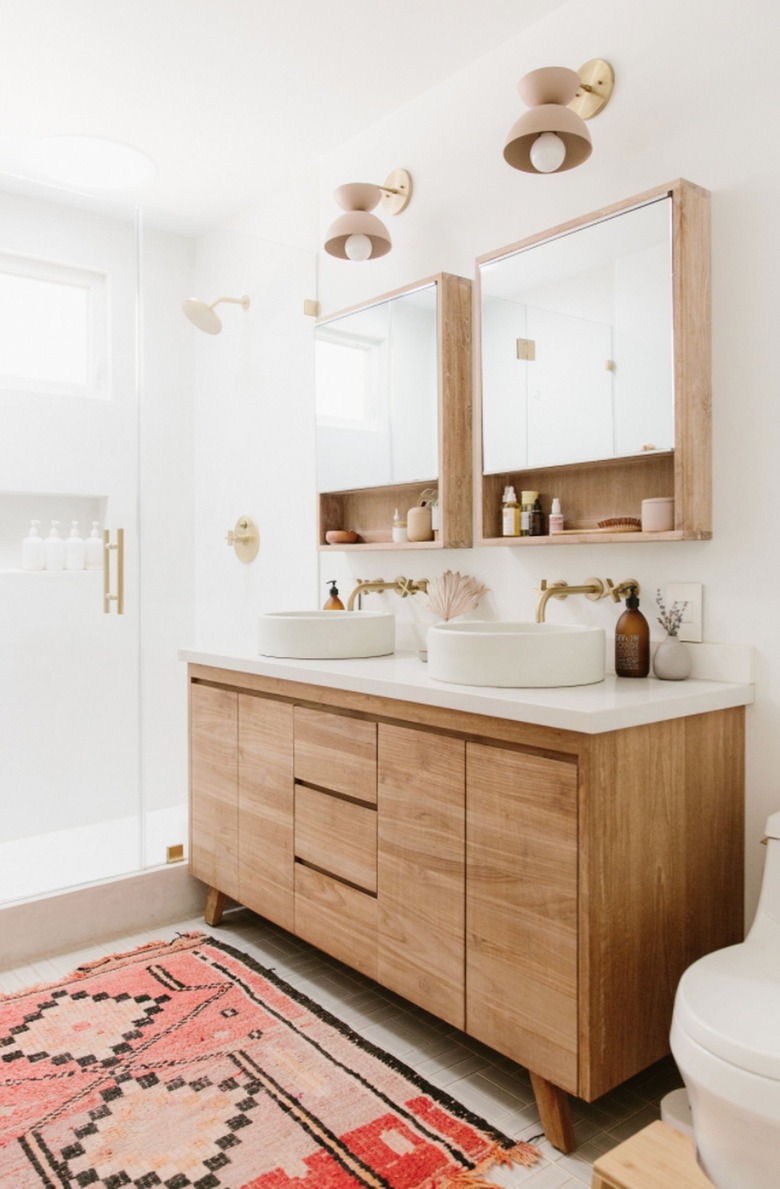 Medicine cabinets side by side with lower shelves.