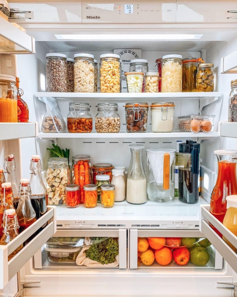 Refrigerator organized with jars.