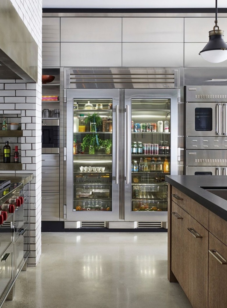 Glass door refrigerator in modern kitchen.