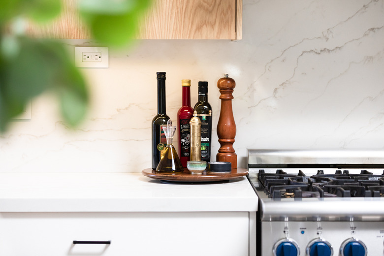 Lazy Susan with olive oils and pepper mill