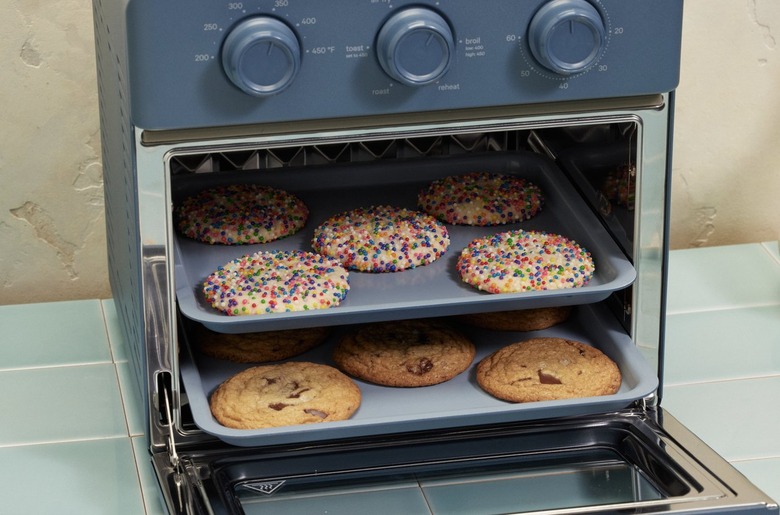 cookies in blue air fryer toaster hybrid