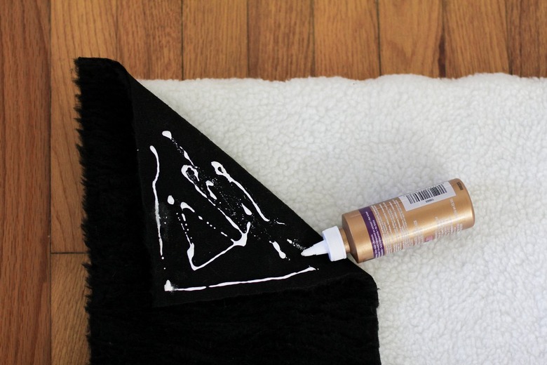 Black shearling fabric with fabric glue on white shearling