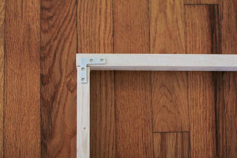 Wood frame with metal flat brace