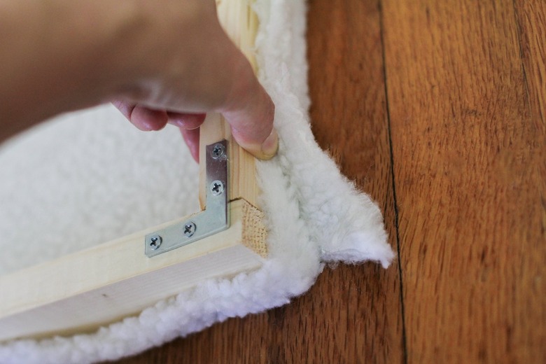 Wood frame surrounded by white shearling