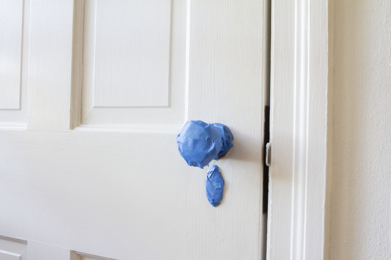 Door knob taped with painter's tape