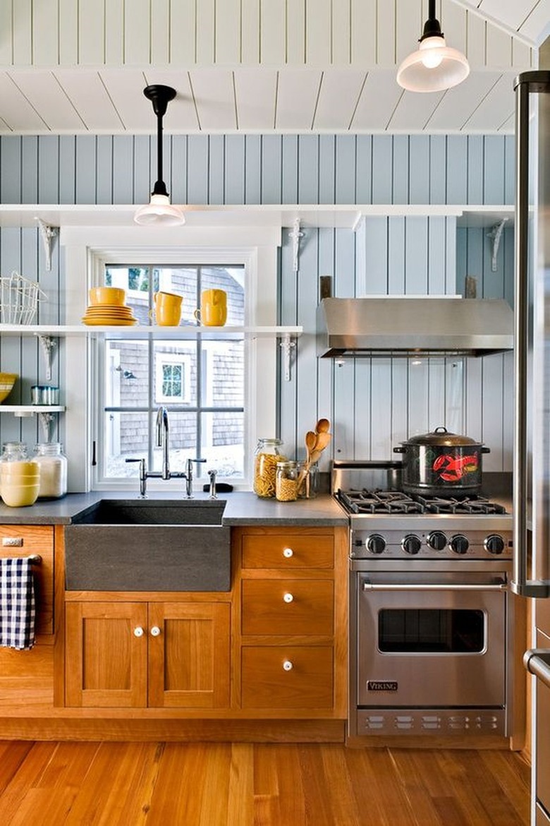 Kitchen with blue shiplap walls