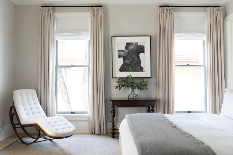 Beige and creme bedroom with dark bedroom furniture