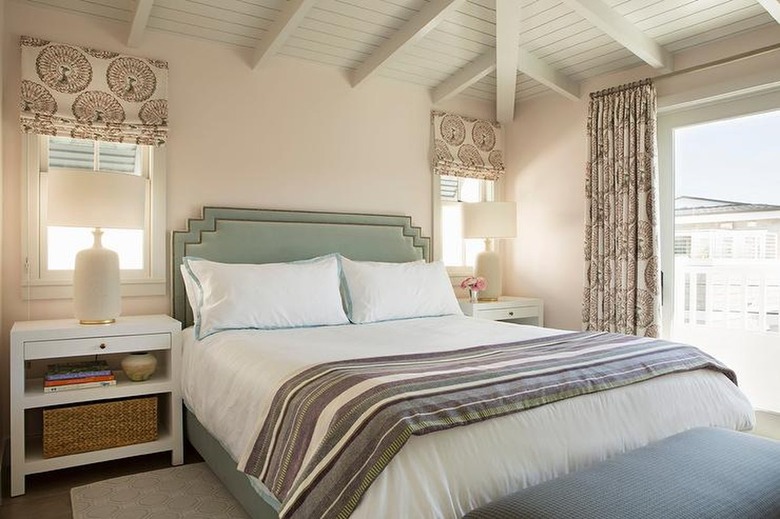 bedroom with cream walls and high ceilings