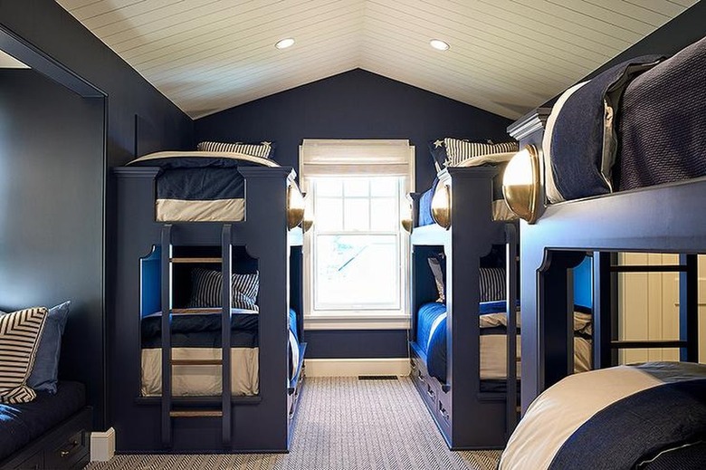 room with navy blue walls and high ceiling