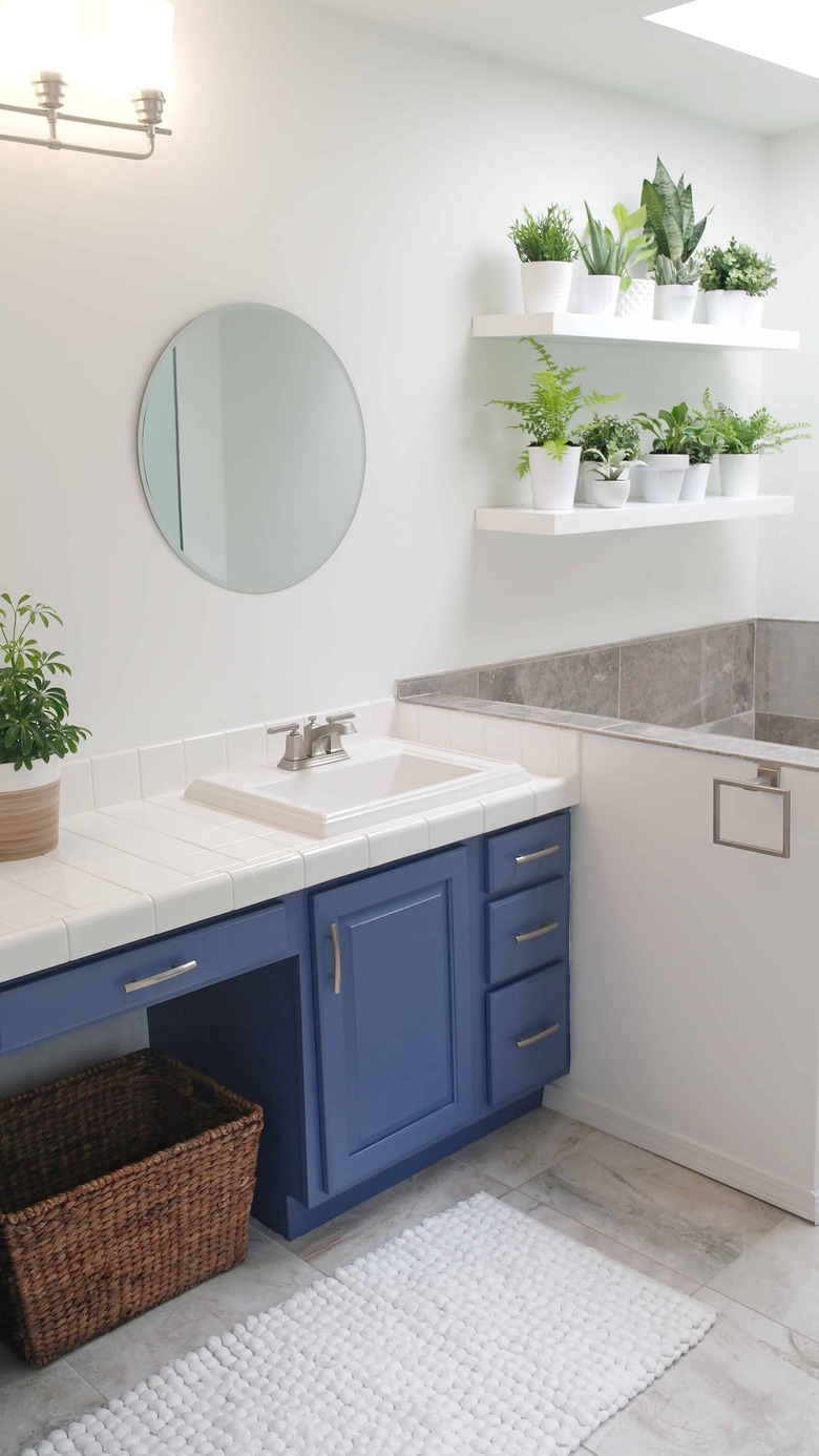 Painted bathroom cabinets before and after featuring modern details and blue cabinets