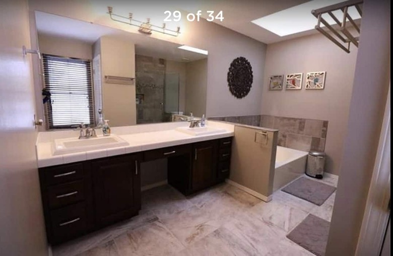 Painted bathroom cabinets before and after featuring dated decor and double vanity