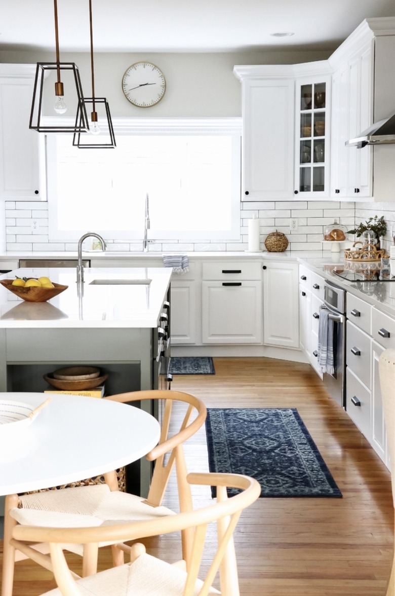 white kitchen cabinets with island in farmhouse kitchen