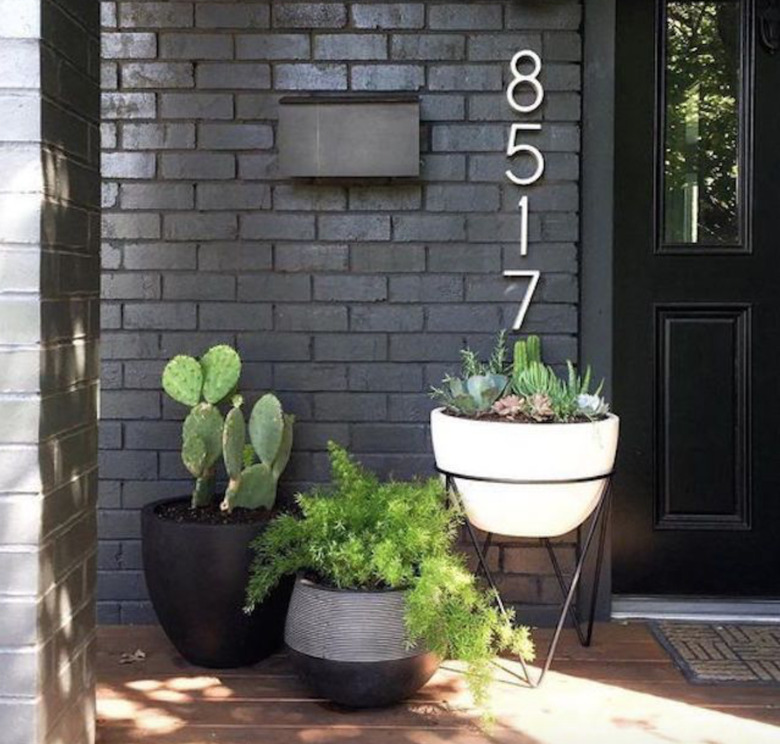 painting exterior brick and a home with cactus in planters