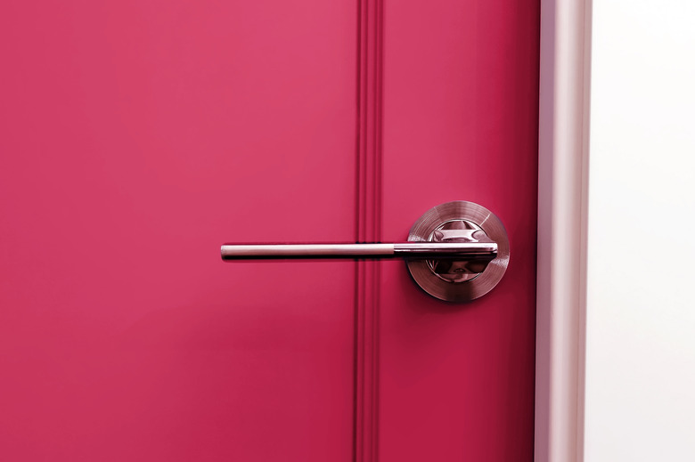 Magenta painter door with handle close-up.